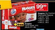 Huggies Dry Comfort Disposable Nappies Midi 3-58's Per Pack + Free Huggies Travel Wipes-24's